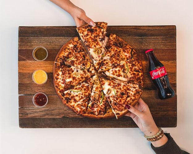 header image Eight slices of pizza with Coke